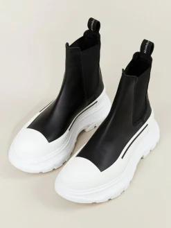 Boots mit breiter Gummisohle Schwarz/Weiß